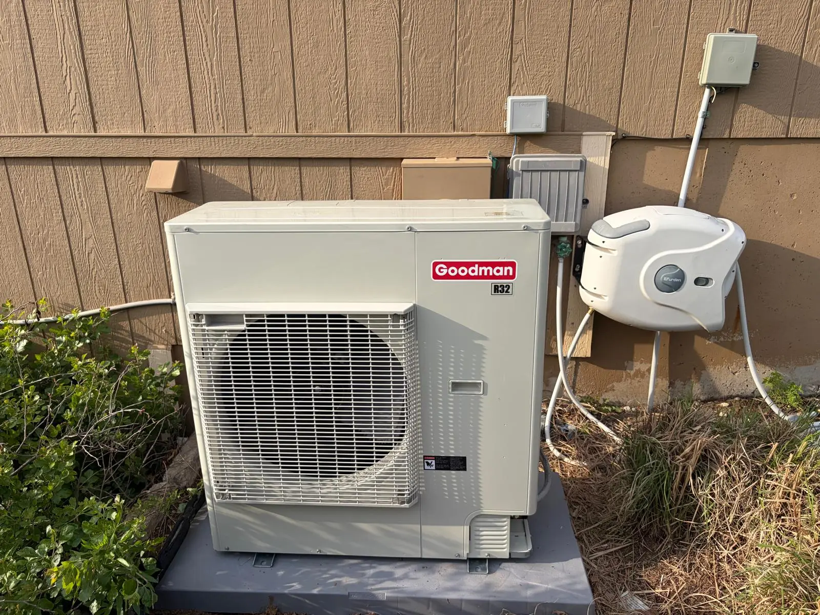 Goodman R32 side-discharge unit with hose reel installation